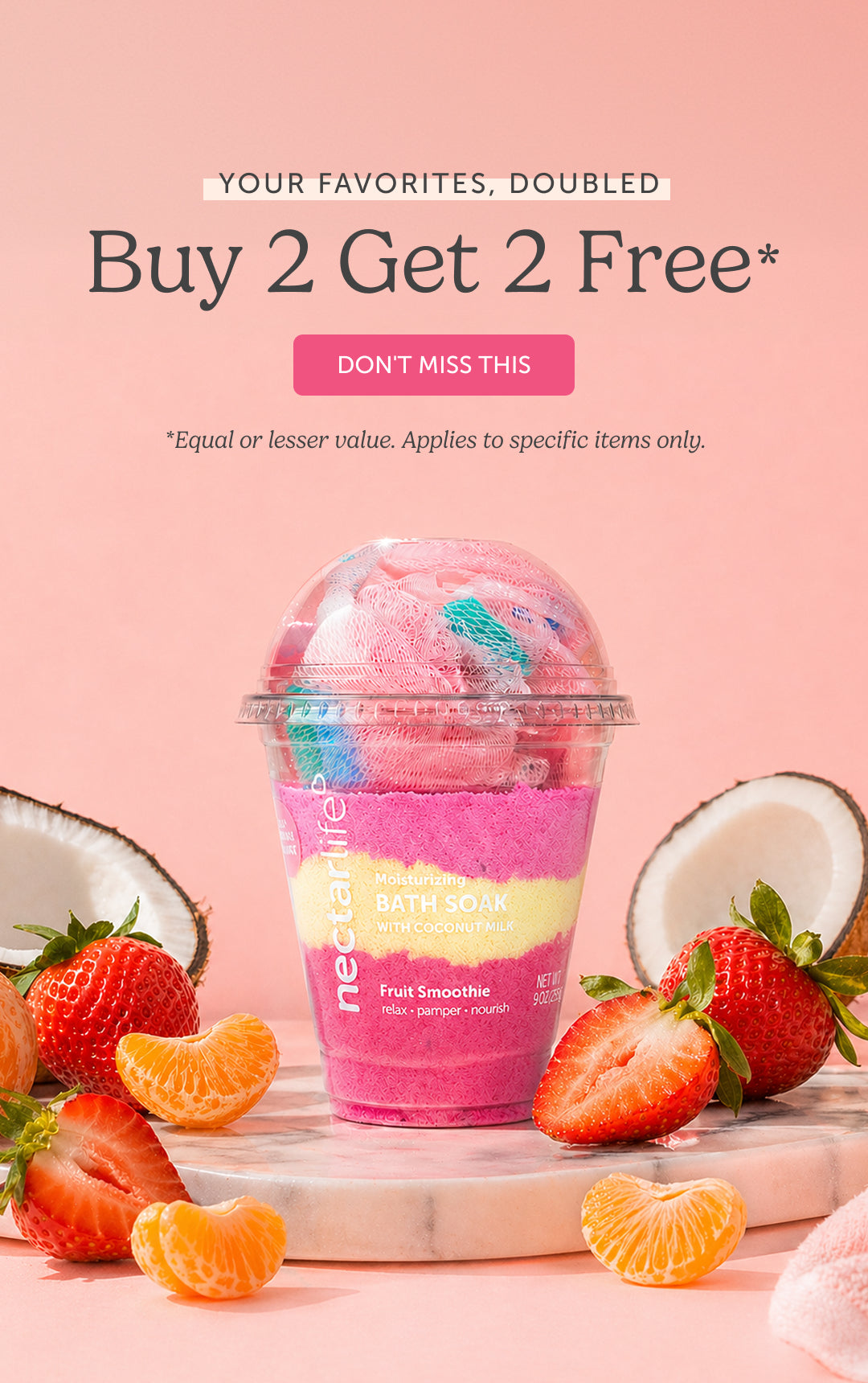Nectar Life Fruit Smoothie Moisturizing Bath Soak with Coconut Milk displayed in a smoothie cup surrounded by strawberries, mandarin oranges, and coconut halves on a pink background. Text reads: Your Favorites, Doubled — Buy 2 Get 2 Free.