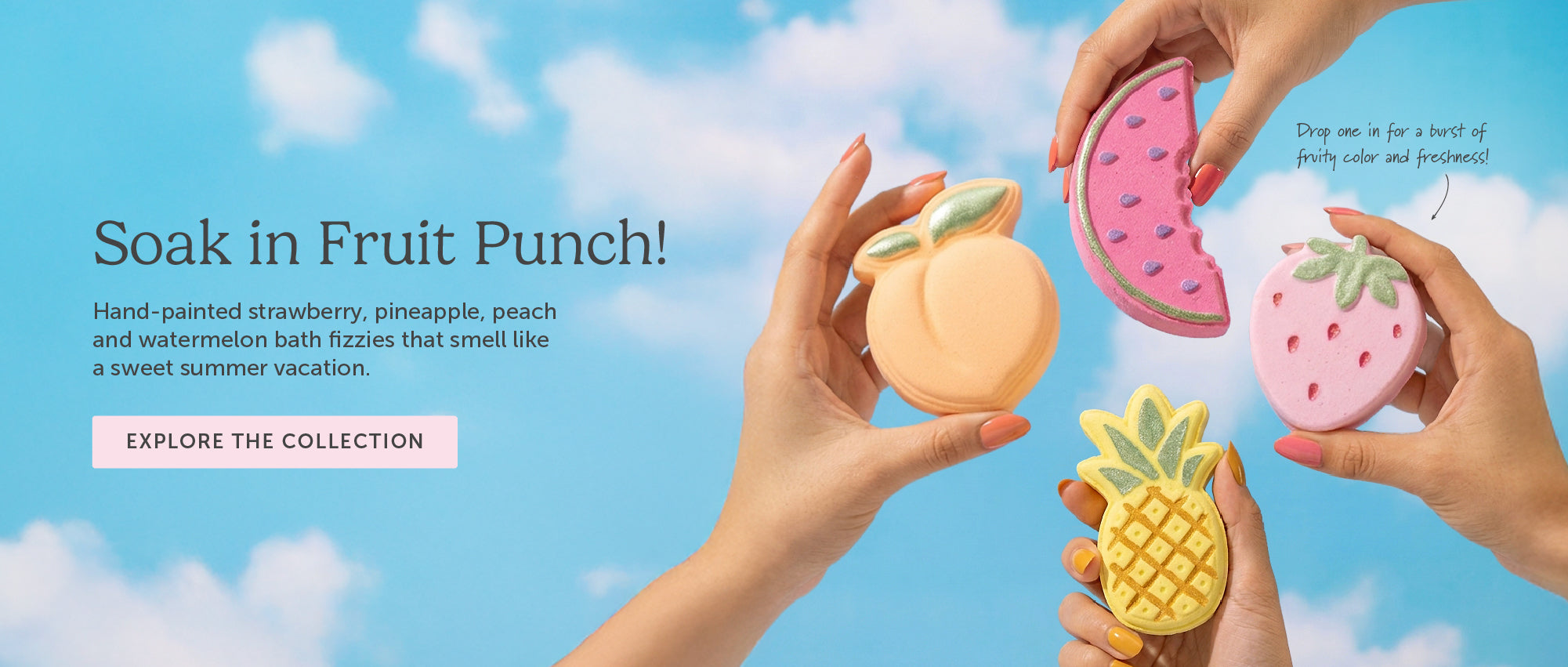 Hands holding four Nectar Life fruit-shaped bath bombs against a blue sky: Juicy Peach, Fresh Watermelon Slice, Strawberry Bliss, and Tropical Pineapple. Text reads: Soak in Fruit Punch! Hand-painted strawberry, pineapple, peach and watermelon bath fizzies that smell like a sweet summer vacation.