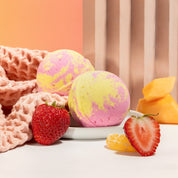  Nectar Life Round Bath Bombs in Fruit Smoothie scent styled with fresh strawberry and citrus on a neutral background, handmade in Las Vegas