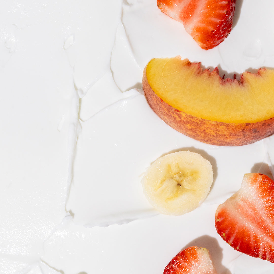 Nectar Life Fruit Smoothie scent ingredients, fresh strawberry, peach, and banana slices with body butter texture, plant-based bath and body products handmade in USA
