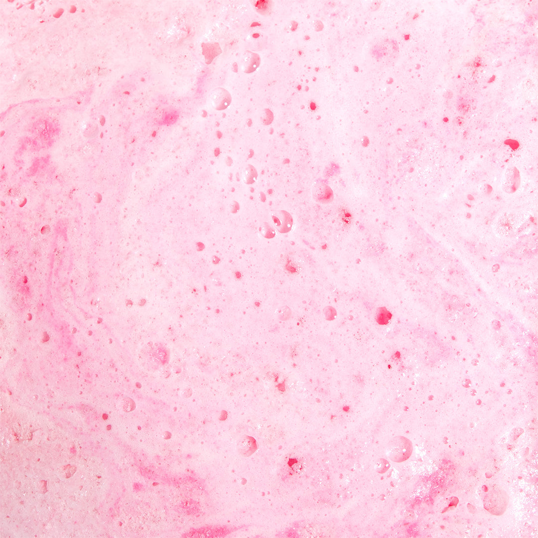 Strawberry Crème bath water texture closeup showing fizzing pink foam, moisturizing bath soak with coconut oil and sea salt by Nectar Life