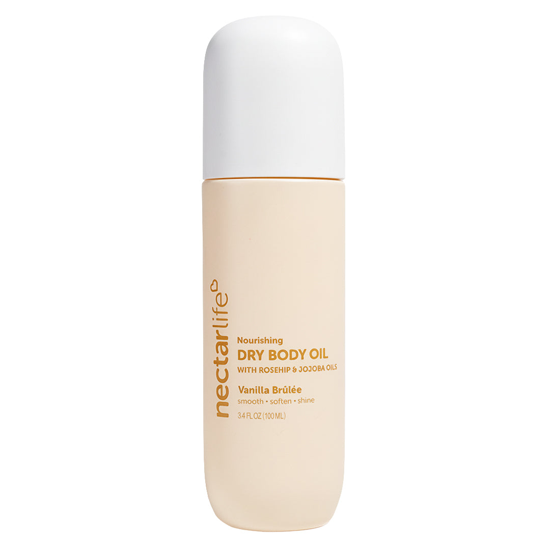 Vanilla Brûlée Nourishing Dry Body Oil by Nectar Life, cream-colored spray bottle with white cap, 3.4 fl oz, with rosehip oil and jojoba oil, handmade in Las Vegas