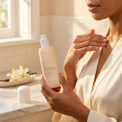 Woman applying Nectar Life Vanilla Brûlée Dry Body Oil to arm, fast-absorbing formula with rosehip oil and jojoba oil, zero residue, 3.4 fl oz