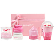 Strawberry Crème Gift Set by Nectar Life with body butter, sugar scrub, whipped soap, milkshake bath soak, and coconut wax candle in a pink gift box with satin ribbon, handmade in Las Vegas