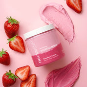 Nectar Life Strawberry Crème Whipped Soap jar surrounded by fresh strawberries on a pink background, award-winning 3-in-1 formula, 5oz