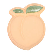 Nectar Life Peach Bath Bomb in Juicy Peach scent, shaped like a whole peach with glittery green leaf detail and soft peach-orange body, handmade bath bomb
