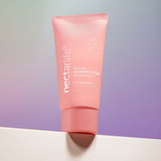 Fruit Smoothie Nourishing Whipped Soap Travel Tube by Nectar Life, pink 2oz travel size tube on a purple gradient background, award-winning vegan formula